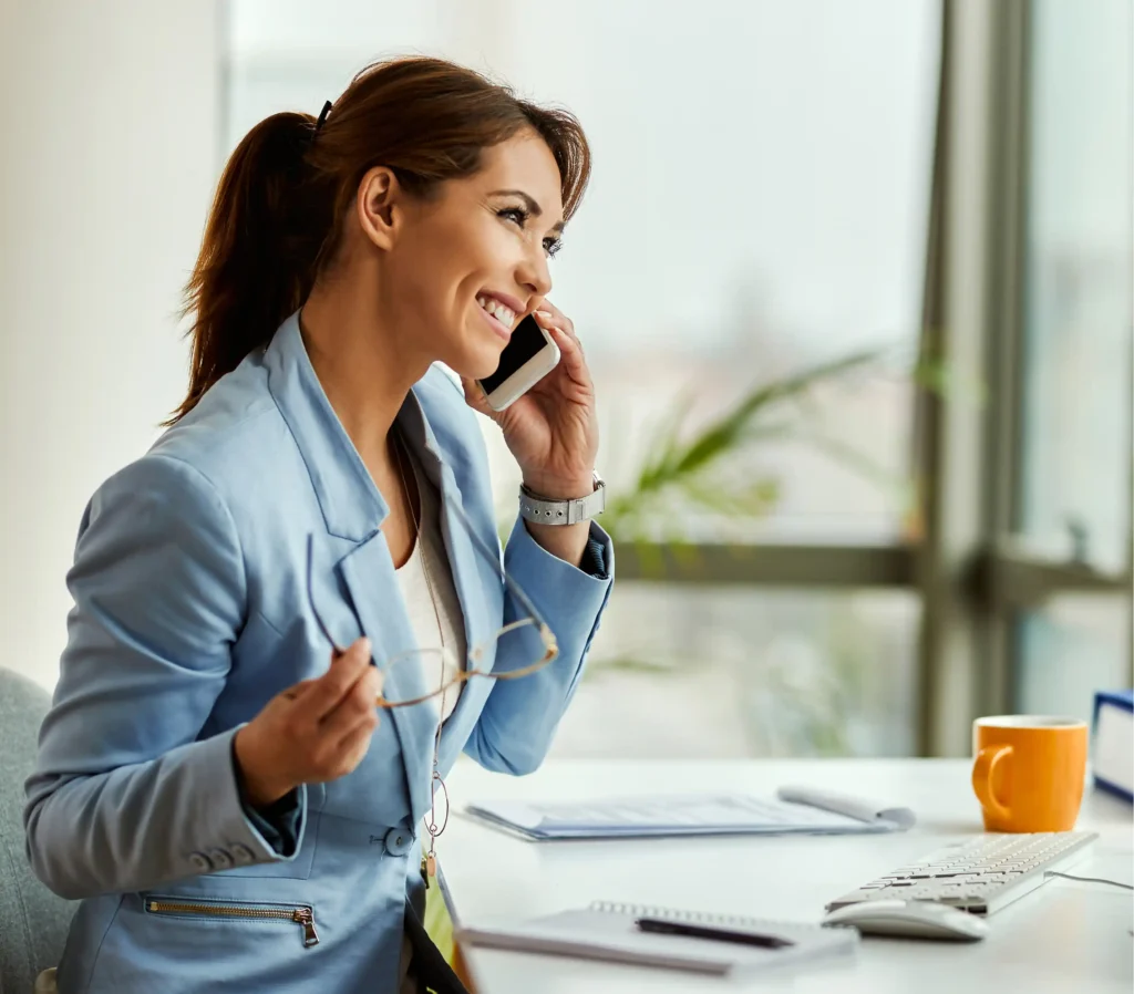 young happy businesswoman using cell phone making phone call office 1 young happy businesswoman using cell phone making phone call office 1